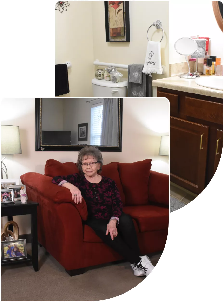 windsor-house-assisted-living-comfortable-living Elderly woman sharing scrapbook with nurse